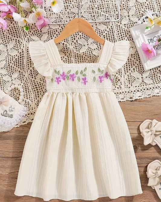 Vestido de mangas con volantes para niñas con delicado bordado floral.